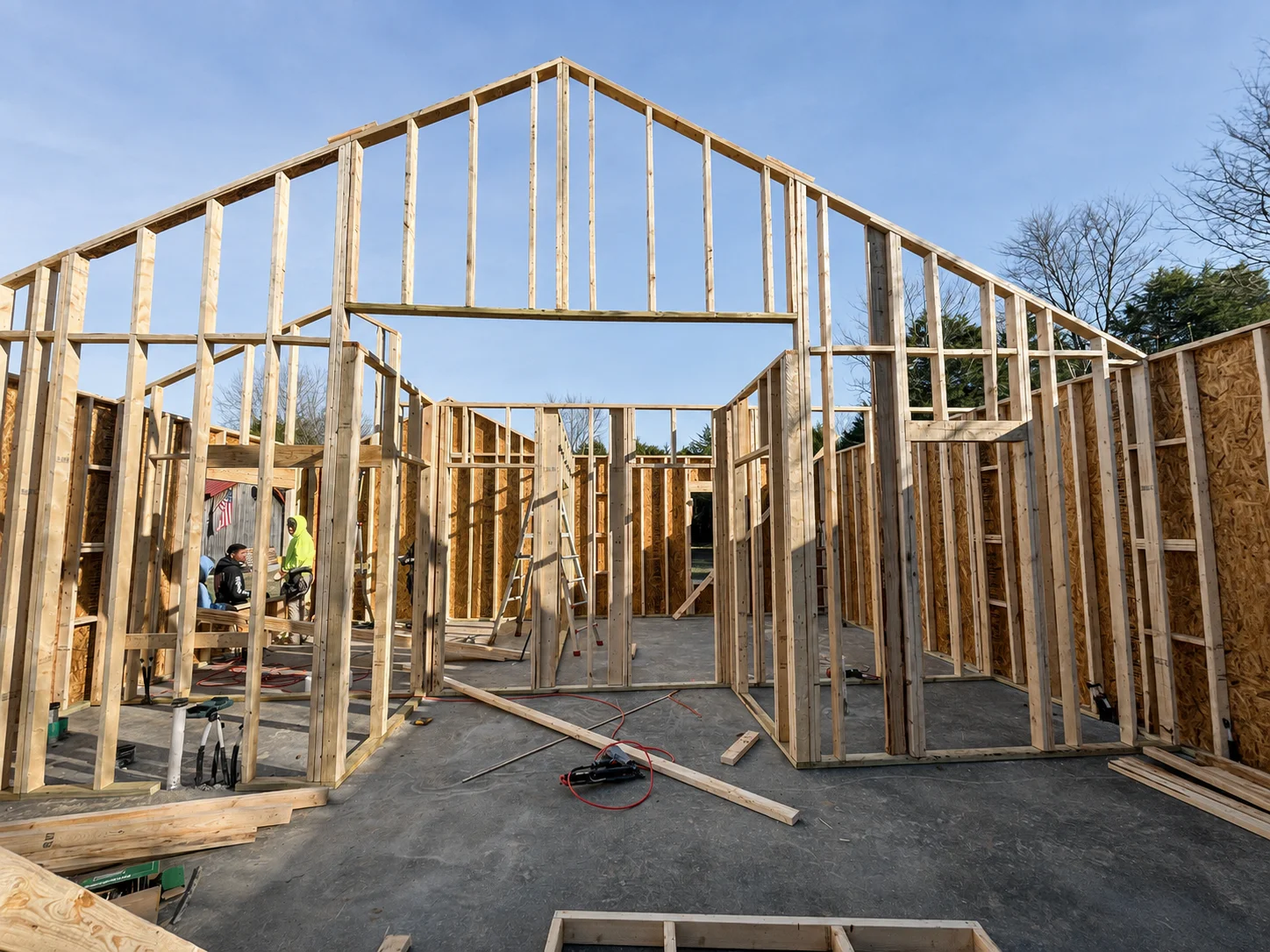 Exposed wall and roof framing during construction — edited project photograph
